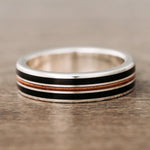 man-in-black-mens-silver-wedding-band-weathered-whiskey-barrel-wood-guitar-string-inlays