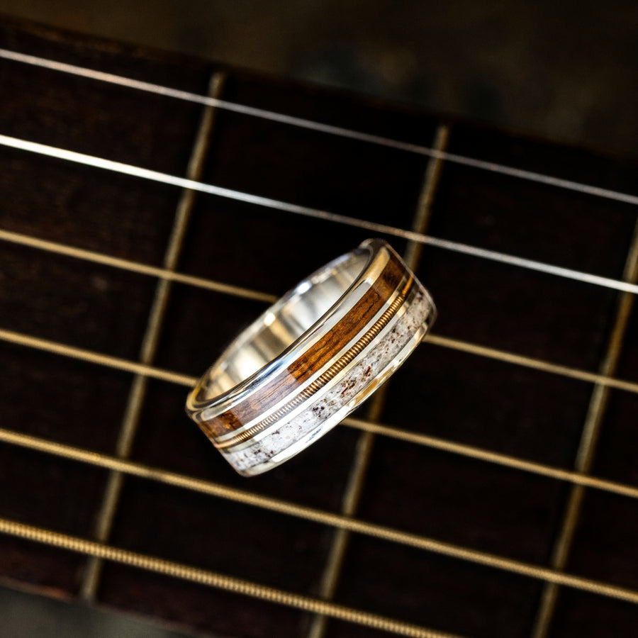 The Pioneer | Men's Gold Wedding Band with Guitar String, Elk Antler & USS North Carolina Battleship Teak Wood