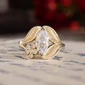 nature-inspired-marquise-diamond-engagement-ring-bezel-set-floral-diamond-accent-leaf-setting-the-magnolia-rustic-and-main