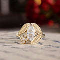 nature-inspired-marquise-diamond-engagement-ring-bezel-set-floral-diamond-accent-leaf-setting-the-magnolia-rustic-and-main