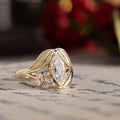 nature-inspired-marquise-diamond-engagement-ring-bezel-set-floral-diamond-accent-leaf-setting-the-magnolia-rustic-and-main