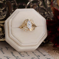 nature-inspired-marquise-diamond-engagement-ring-bezel-set-floral-diamond-accent-leaf-setting-the-magnolia-rustic-and-main