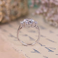 oval-diamond-three-stone-engagement-ring-half-moon-side-stones-the-harriet-rustic-and-main