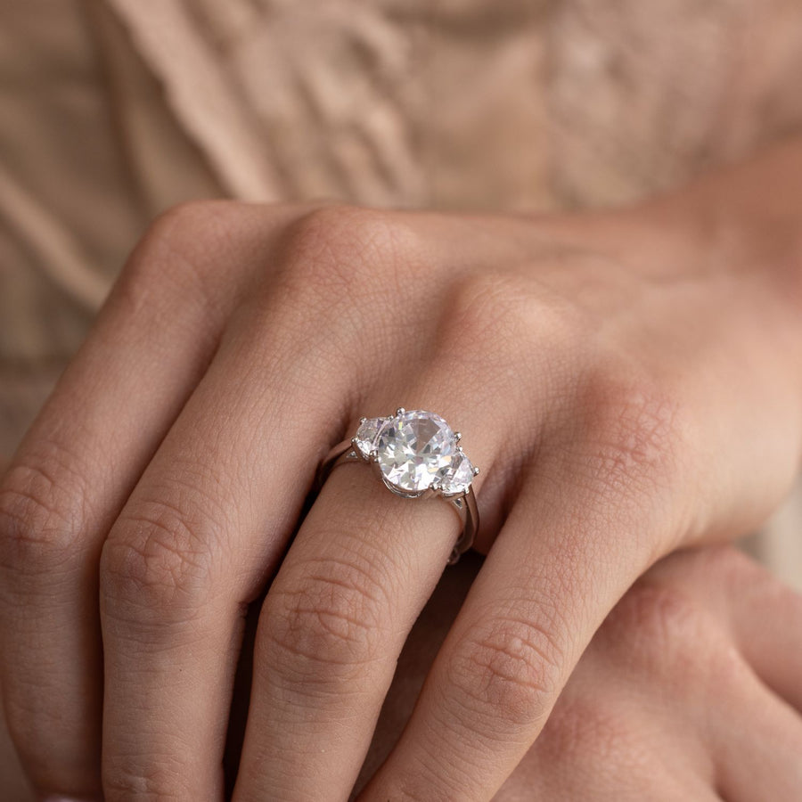 oval-diamond-three-stone-engagement-ring-half-moon-side-stones-the-harriet-rustic-and-main