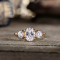 oval-diamond-three-stone-engagement-ring-round-diamond-accents-trilogy-the-wren-rustic-and-main