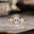 oval-diamond-three-stone-engagement-ring-round-diamond-accents-trilogy-the-wren-rustic-and-main