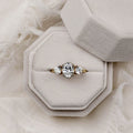 oval-diamond-three-stone-engagement-ring-round-diamond-accents-trilogy-the-wren-rustic-and-main