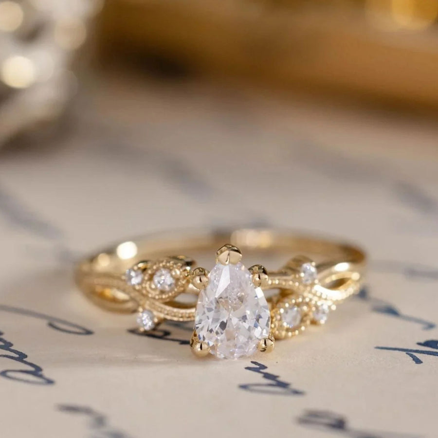 pear-shaped-diamond-engagement-ring-nature-inspired-accents-the-larkwood-rustic-and-main