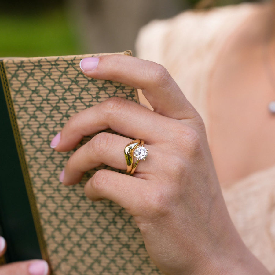 three-stone-emerald-cut-diamond-engagement-ring-round-diamond-accents-bezel-setting-the-marcelline-rustic-and-main