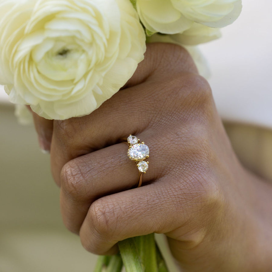 oval-diamond-three-stone-engagement-ring-round-diamond-accents-trilogy-the-wren-rustic-and-main