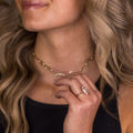the-hazel-emerald-cut-bezel-engagement-ring-with-diamond-halo