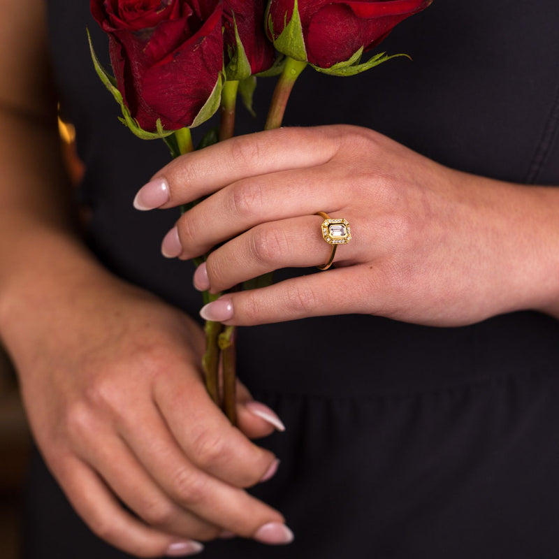 the-margot-emerald-cut-bezel-diamond-halo-engagement-ring