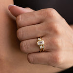 three-stone-emerald-cut-diamond-engagement-ring-round-diamond-accents-bezel-setting-the-marcelline-rustic-and-main