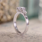 round-diamond-three-stone-engagement-ring-pear-shaped-diamond-accents-the-odette-rustic-and-main