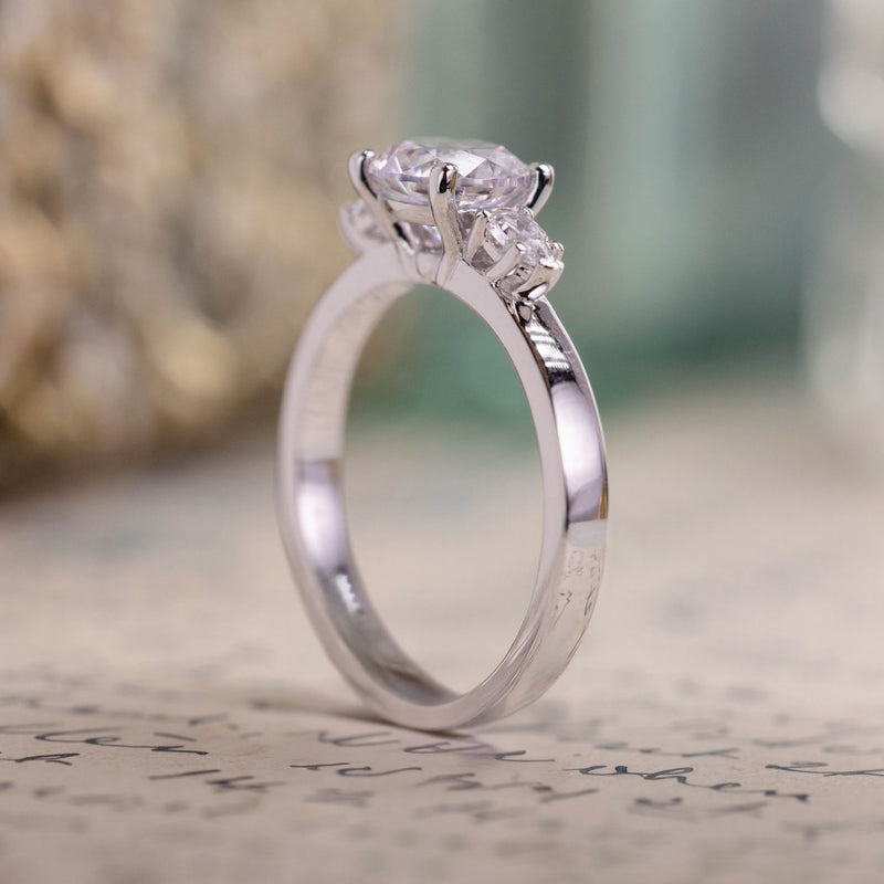 round-diamond-three-stone-engagement-ring-pear-shaped-diamond-accents-the-odette-rustic-and-main