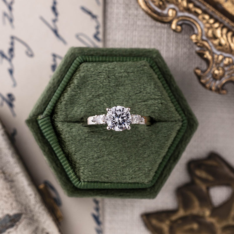 round-diamond-three-stone-engagement-ring-pear-shaped-diamond-accents-the-odette-rustic-and-main