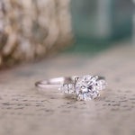 round-diamond-three-stone-engagement-ring-pear-shaped-diamond-accents-the-odette-rustic-and-main