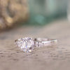 round-diamond-three-stone-engagement-ring-pear-shaped-diamond-accents-the-odette-rustic-and-main