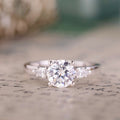 The Odette | Three Stone Round Diamond Engagement Ring with Pear-Shaped Diamond Side Stones