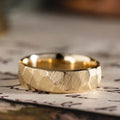 the-apollo-mens-thin-hammered-gold-wedding-band