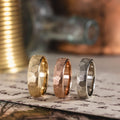 the-apollo-mens-thin-hammered-gold-wedding-band