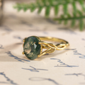 beatrix-yellow-gold-oval-moss-agate-ring-angled-close-up