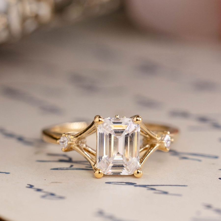 the-celeste-emerald-cut-diamond-engagement-ring-split-shank-diamond-accents