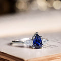 the-diana-blue-sapphire-pear-cut-three-stone-engagement-ring-diamond-accents