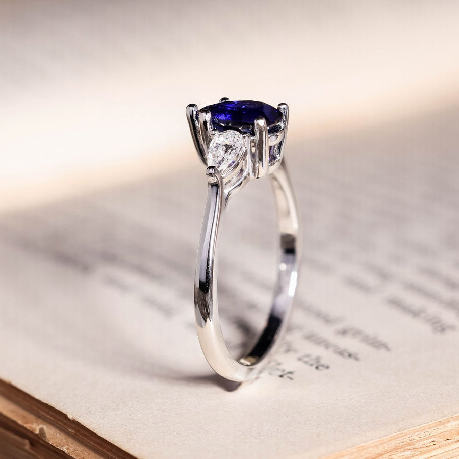 the-diana-blue-sapphire-pear-cut-three-stone-engagement-ring-diamond-accents
