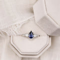 the-diana-blue-sapphire-pear-cut-three-stone-engagement-ring-diamond-accents