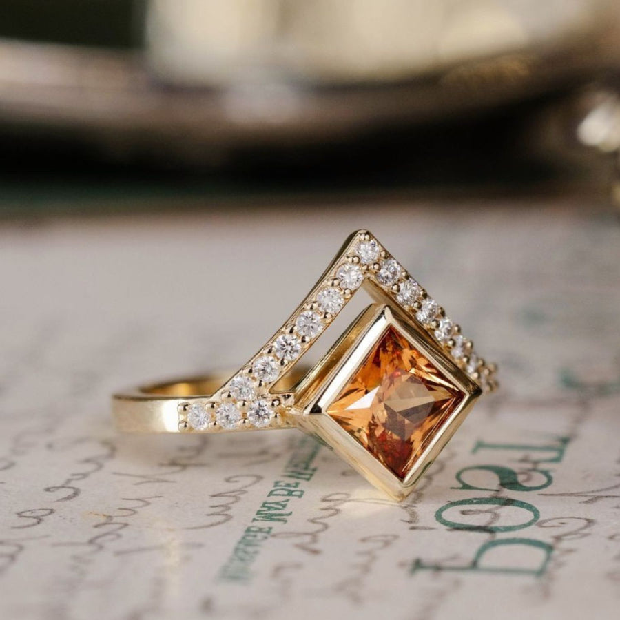 the-eileen-art-deco-inspired-princess-cut-padparadscha-sapphire-engagement-ring-diamond-accents