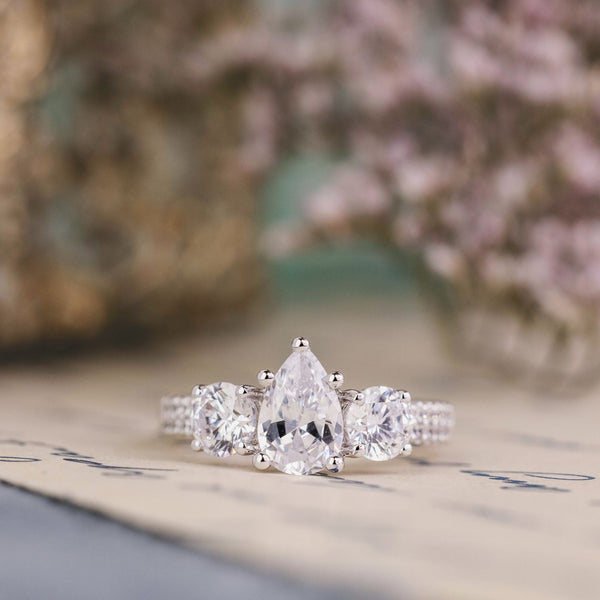 the-elenor-three-stone-pear-two-row-diamond-engagement-ring