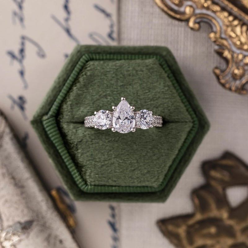 Pear-Cut Three-Stone with Two-Row Pavé Shank