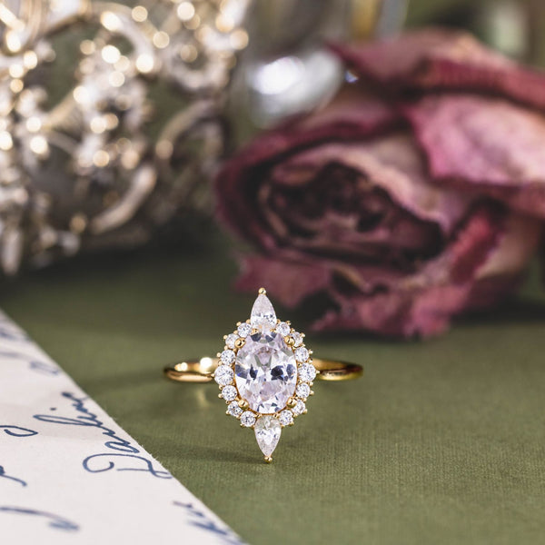 the-eliza-vintage-inspired-oval-diamond-ring-starburst-halo