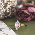 the-eliza-vintage-inspired-oval-diamond-ring-starburst-halo