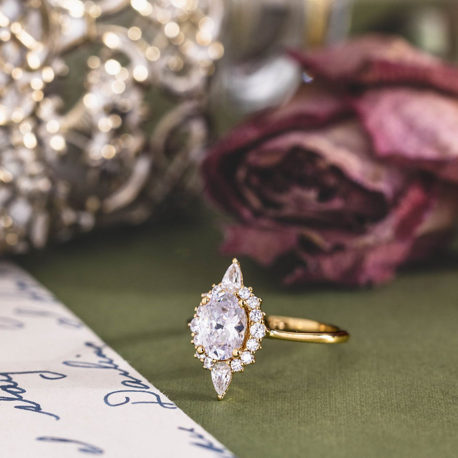the-eliza-vintage-inspired-oval-diamond-ring-starburst-halo