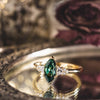 the-guinevere-green-sapphire-marquise-cut-engagement-ring-with-diamond-accents