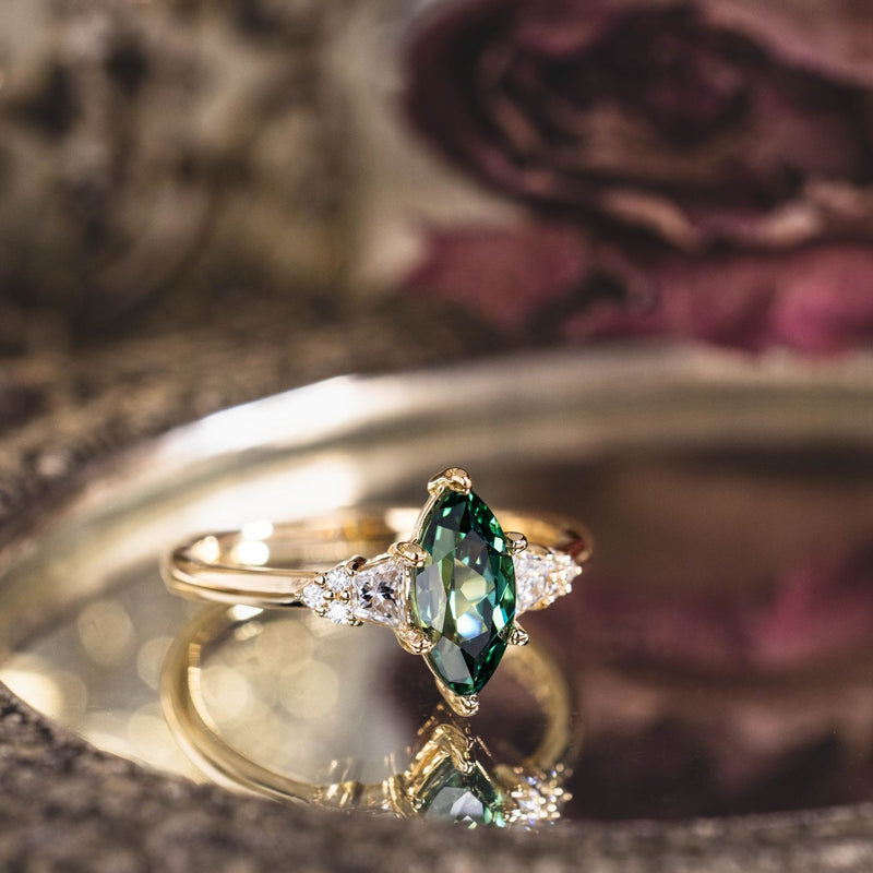 the-guinevere-green-sapphire-marquise-cut-engagement-ring-with-diamond-accents