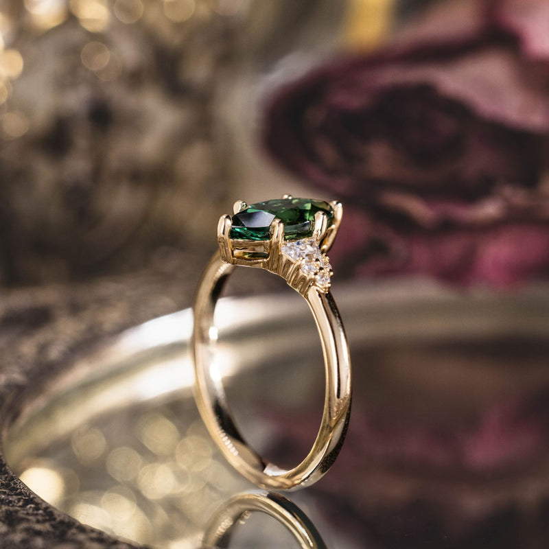 the-guinevere-green-sapphire-marquise-cut-engagement-ring-with-diamond-accents