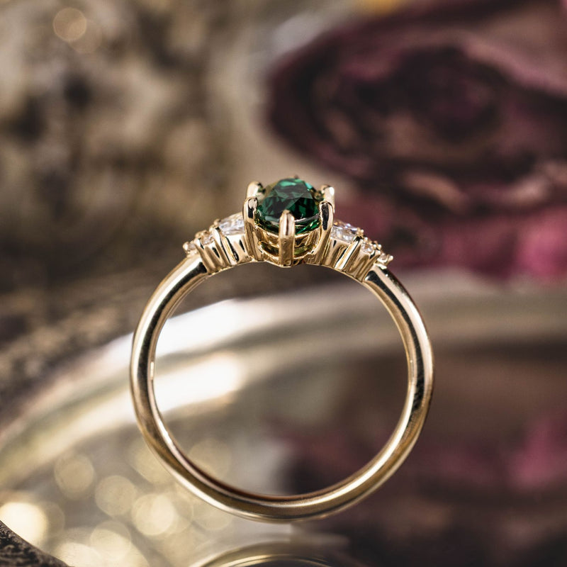 the-guinevere-green-sapphire-marquise-cut-engagement-ring-with-diamond-accents