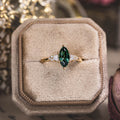 the-guinevere-green-sapphire-marquise-cut-engagement-ring-with-diamond-accents