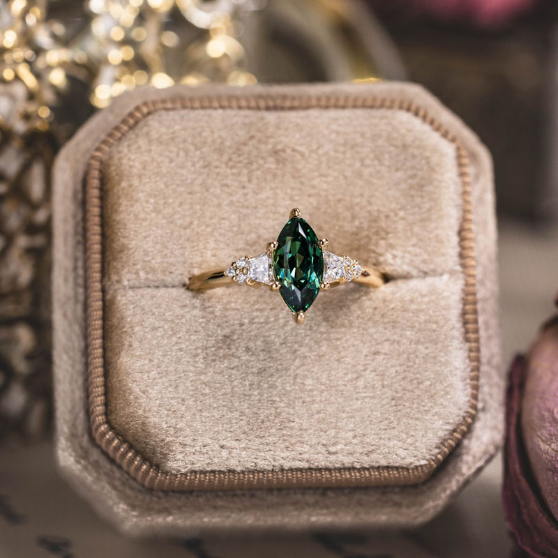 the-guinevere-green-sapphire-marquise-cut-engagement-ring-with-diamond-accents