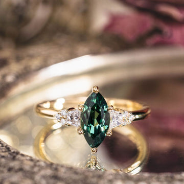 the-guinevere-green-sapphire-marquise-cut-engagement-ring-with-diamond-accents