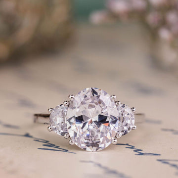 the-harriet-oval-diamond-three-stone-engagement-ring-half-moon-side-stones