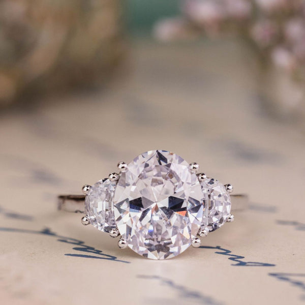 the-harriet-oval-diamond-three-stone-engagement-ring-half-moon-side-stones