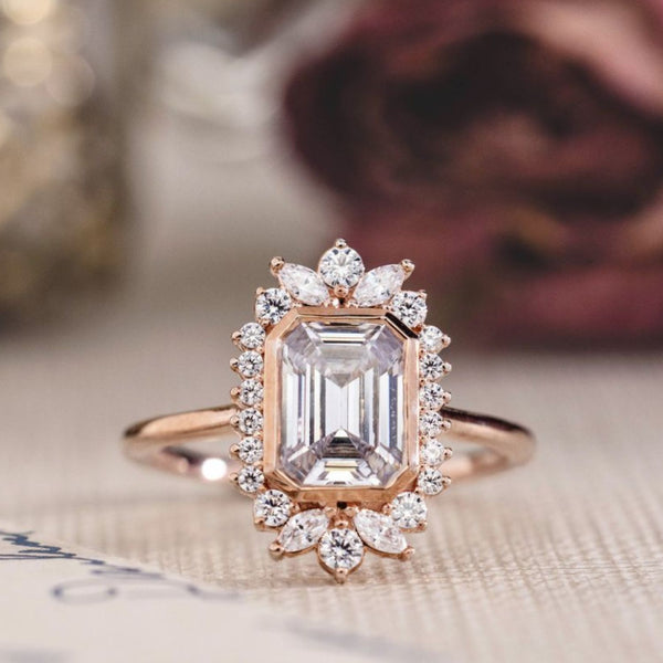the-hazel-emerald-cut-bezel-engagement-ring-with-diamond-halo