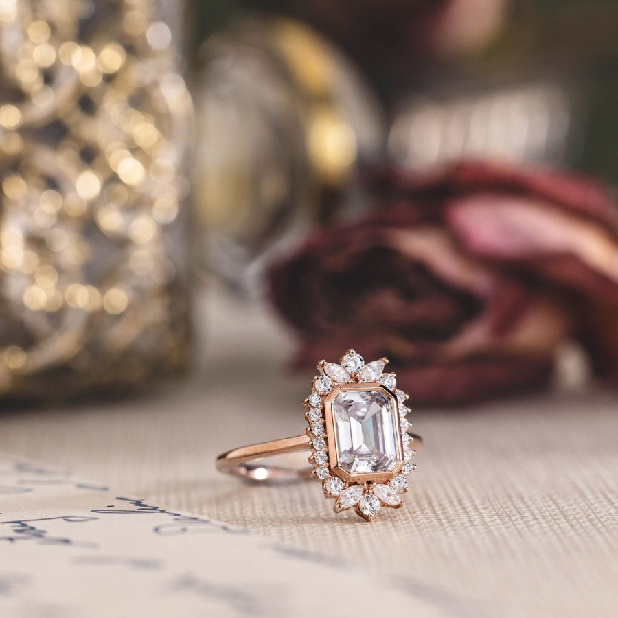 the-hazel-emerald-cut-bezel-engagement-ring-with-diamond-halo
