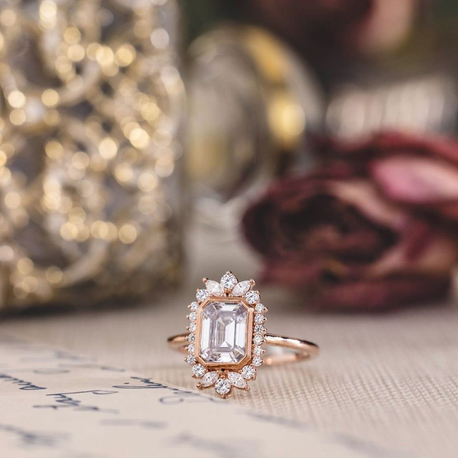 the-hazel-emerald-cut-bezel-engagement-ring-with-diamond-halo