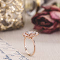 the-hazel-emerald-cut-bezel-engagement-ring-with-diamond-halo