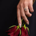 the-hazel-emerald-cut-bezel-engagement-ring-with-diamond-halo